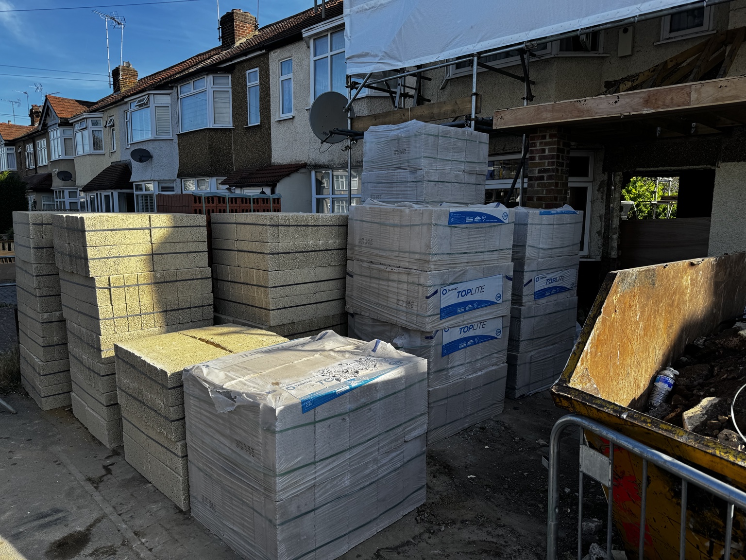 Pallets of concrete and lightweight blocks at a renovation