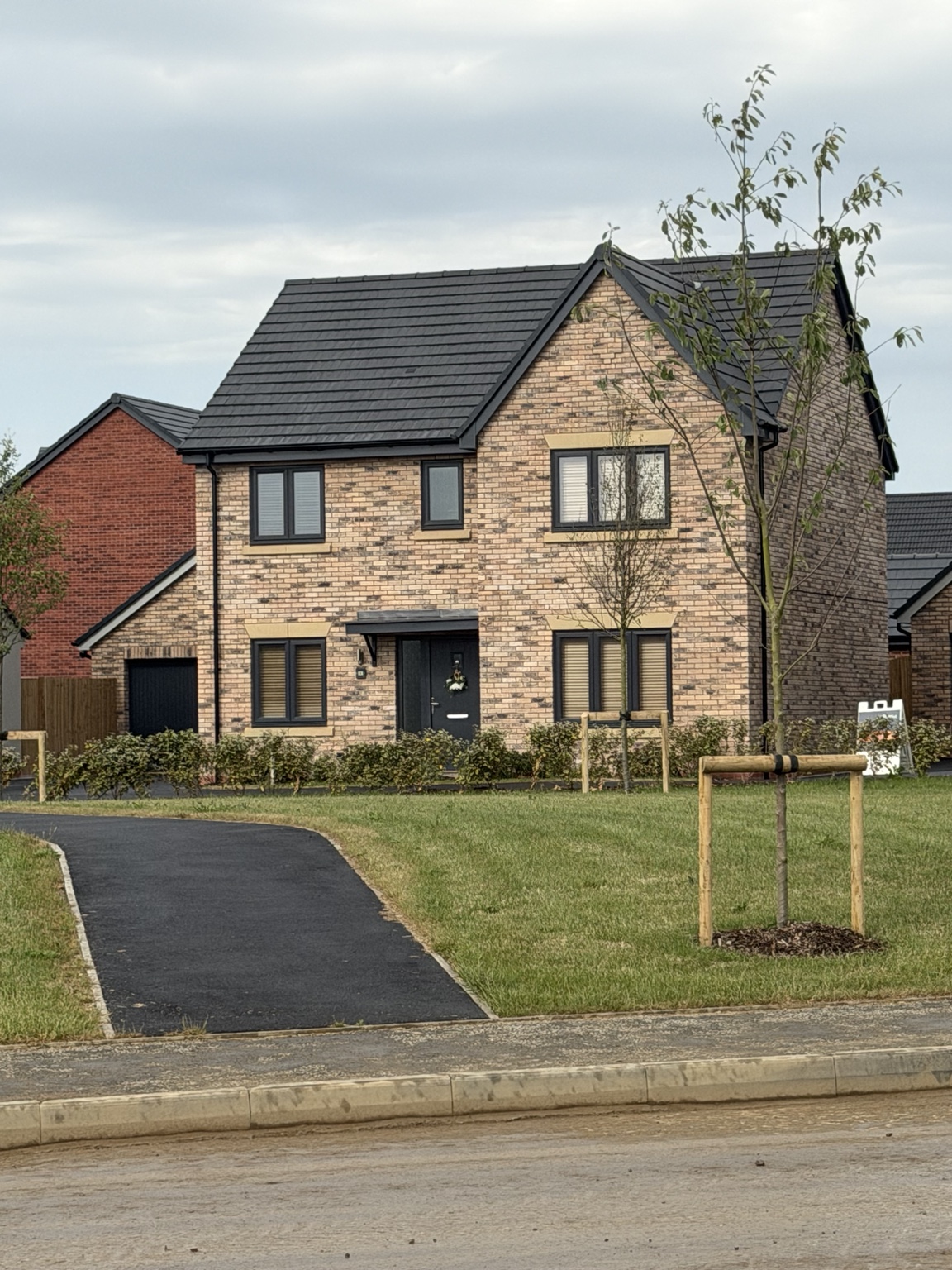 Completed modern brick home supplied by AGP Building Supplies